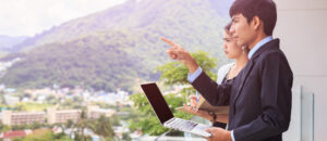 Young Asian Businessman Standing At The Terrace Looking To Build