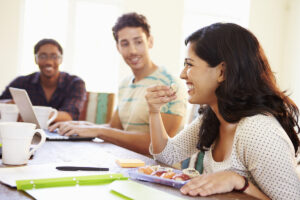 Business People Having Meeting And Eating Sushi